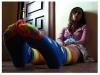 sad girl with rainbow socks