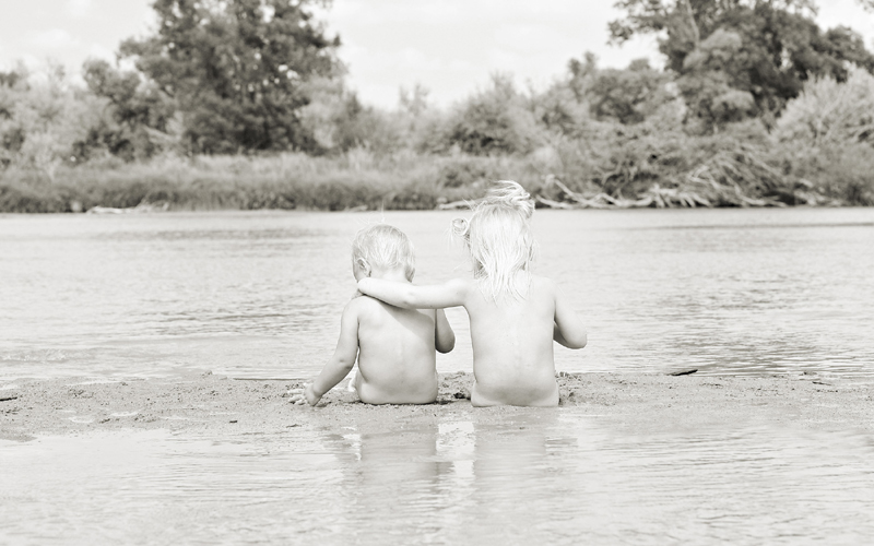 Girls Sitting at the River