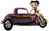 Betty Boop sitting on the hood of an old coup